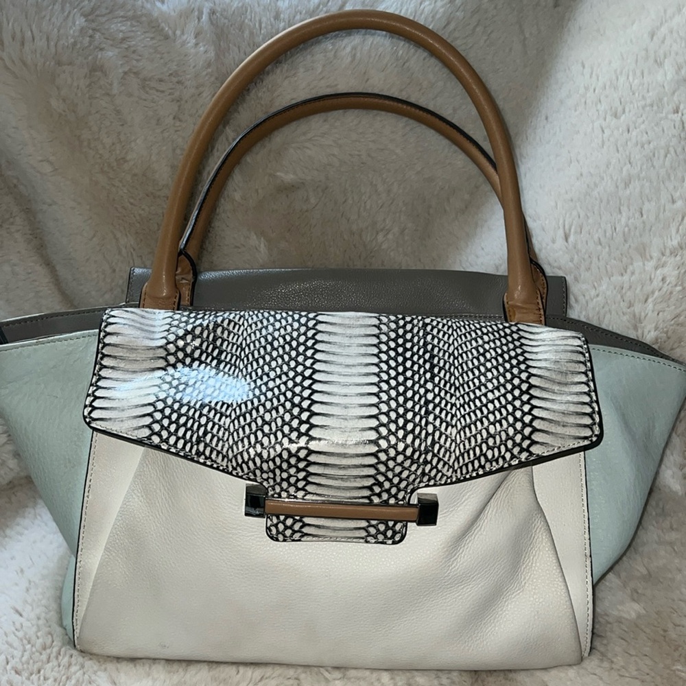Sea blue, tan and cream bag! Gently used. Beautiful with lots of pocket space!